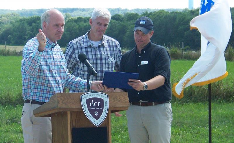 Congressman William Keating, left, presents Brendan Annett, center, and Coalition President Mark Rasmussen with a citation from the House of Representatives. BY MATTHEW BERNAT
